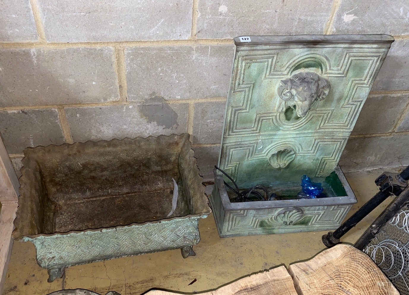 A faux lead ram's head garden fountain, height 75cm, together with a faux cast iron rectangular garden planter